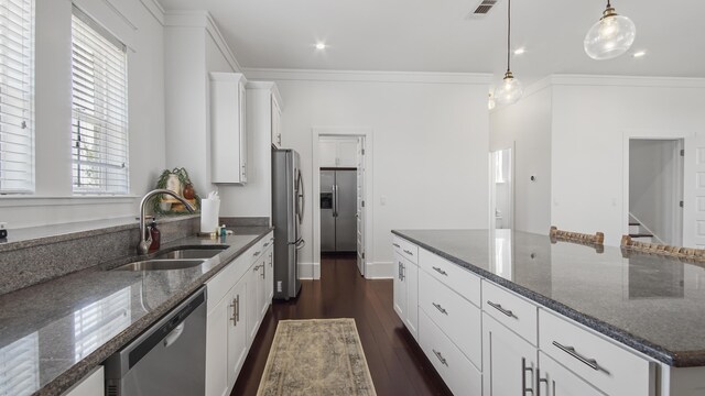 294 Gulfview Cir, Santa Rosa Beach, FL 32459 - kitchen with a sink, white cabinets, ornamental molding, and stainless steel appliances