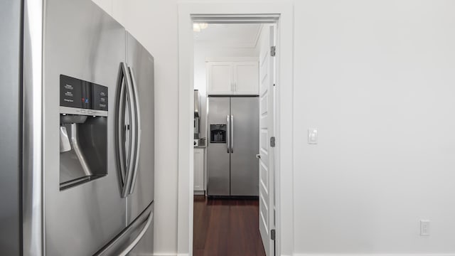294 Gulfview Cir, Santa Rosa Beach, FL 32459 - kitchen featuring stainless steel fridge, white cabinetry, and dark wood-type flooring