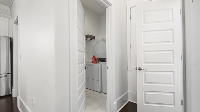294 Gulfview Cir, Santa Rosa Beach, FL 32459 - clothes washing area featuring laundry area, washing machine and dryer, marble finish floor, and baseboards