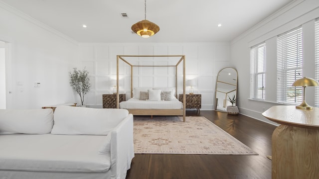 294 Gulfview Cir, Santa Rosa Beach, FL 32459 - bedroom featuring visible vents, ornamental molding, dark wood-style floors, a decorative wall, and baseboards
