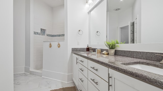 294 Gulfview Cir, Santa Rosa Beach, FL 32459 - full bath featuring visible vents, double vanity, a sink, a walk in shower, and marble finish floor