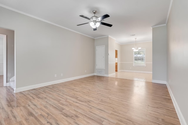 empty room featuring baseboards, ceiling fan with notable chandelier, ornamental molding, and light wood finished floors