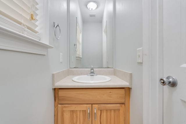 bathroom with visible vents and vanity