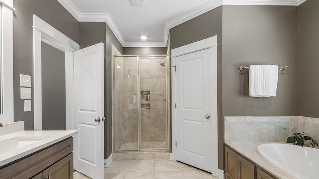 bathroom with vanity, a stall shower, a garden tub, and crown molding