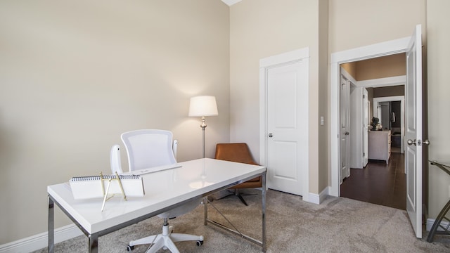 carpeted office with baseboards