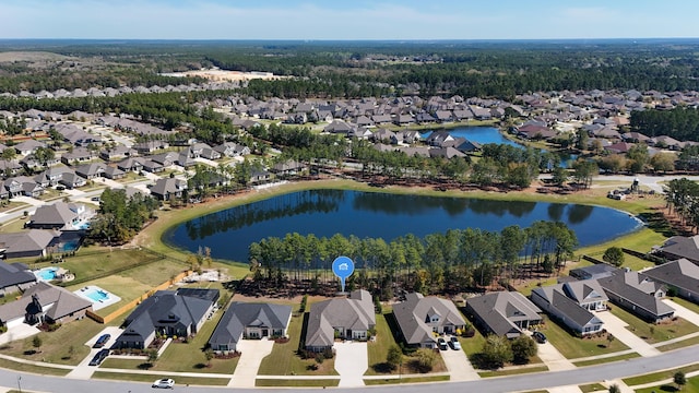 drone / aerial view featuring a residential view and a water view