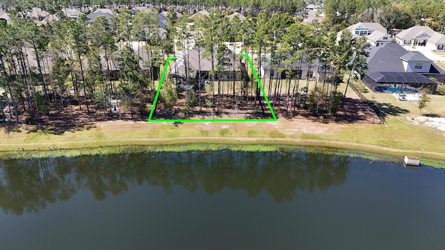 drone / aerial view featuring a water view and a residential view