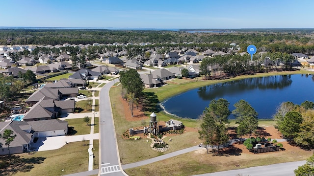drone / aerial view featuring a residential view and a water view