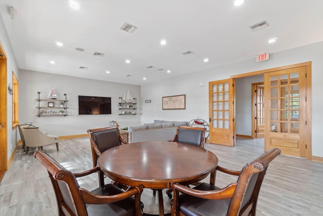 194 Mill Pond Cv, Freeport, FL 32439 - dining area featuring french doors, light wood finished floors, recessed lighting, and baseboards