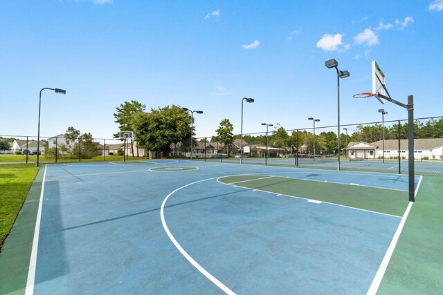194 Mill Pond Cv, Freeport, FL 32439 - view of basketball court featuring a tennis court, community basketball court, and fence