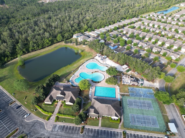 194 Mill Pond Cv, Freeport, FL 32439 - view of property location featuring a forest, a nearby body of water, and a pool area