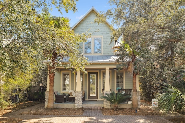 26 Classic Court Ln, Santa Rosa Beach, FL 32459 - view of front facade featuring a standing seam roof, a porch, and metal roof