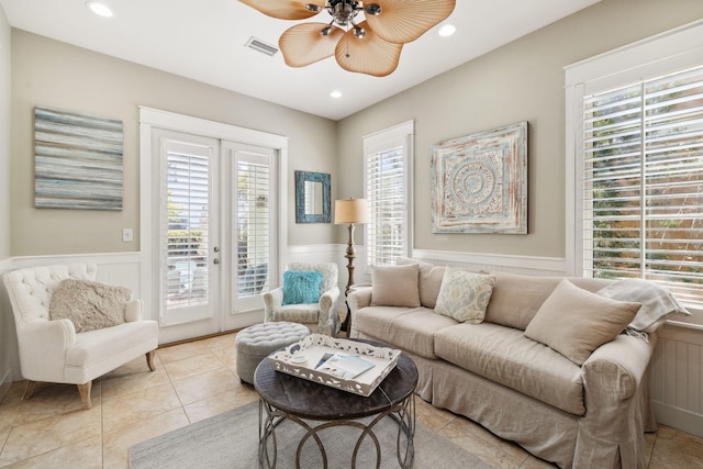 26 Classic Court Ln, Santa Rosa Beach, FL 32459 - living area featuring visible vents, a wainscoted wall, and a healthy amount of sunlight