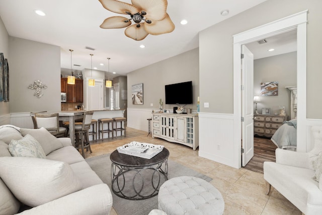 26 Classic Court Ln, Santa Rosa Beach, FL 32459 - living room featuring ceiling fan, visible vents, recessed lighting, a wainscoted wall, and light tile patterned flooring