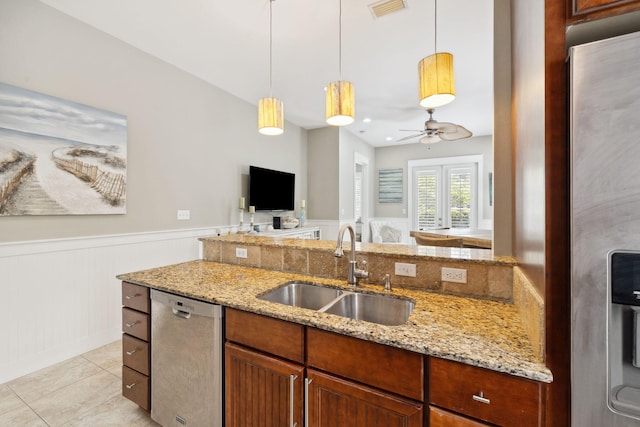 26 Classic Court Ln, Santa Rosa Beach, FL 32459 - kitchen with a ceiling fan, visible vents, a sink, wainscoting, and stainless steel appliances