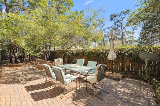 26 Classic Court Ln, Santa Rosa Beach, FL 32459 - view of patio with outdoor dining space and fence