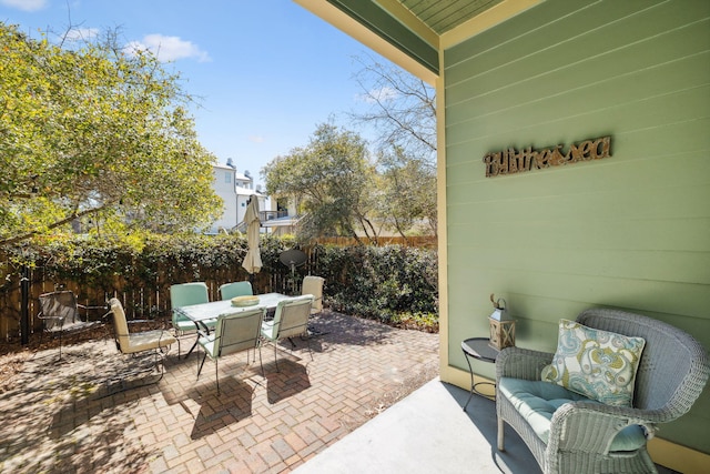 26 Classic Court Ln, Santa Rosa Beach, FL 32459 - view of patio / terrace featuring outdoor dining space, a fenced backyard, and an outdoor hangout area