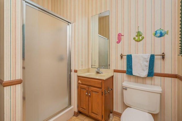 24776 Fifth Ave, Florala, AL 36442 - full bathroom featuring toilet, a stall shower, wallpapered walls, and vanity