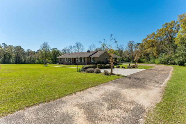 24776 Fifth Ave, Florala, AL 36442 - single story home featuring a front lawn and curved driveway