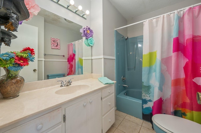 24776 Fifth Ave, Florala, AL 36442 - full bathroom with tile patterned floors, shower / bathtub combination with curtain, toilet, a textured ceiling, and vanity