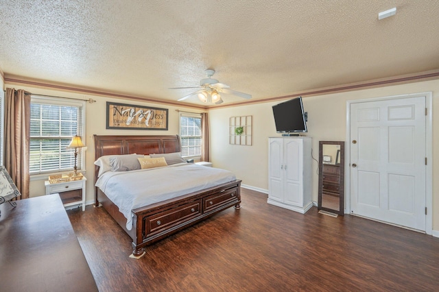 24776 Fifth Ave, Florala, AL 36442 - bedroom featuring a textured ceiling, a ceiling fan, baseboards, and dark wood-style flooring