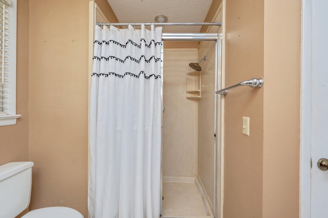 24776 Fifth Ave, Florala, AL 36442 - full bathroom featuring toilet, a stall shower, and a textured ceiling