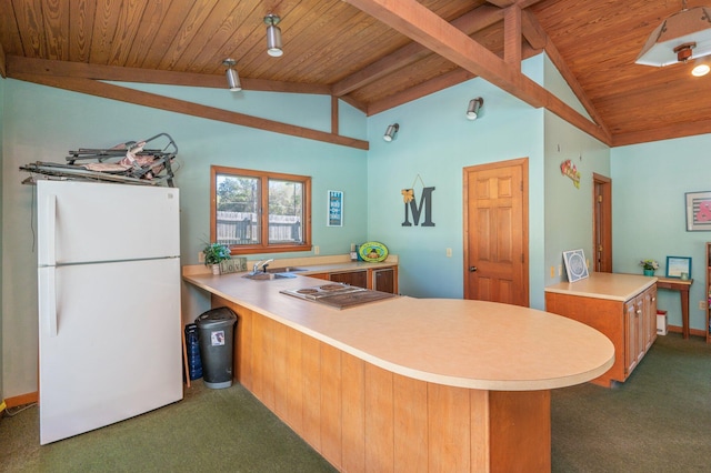 24776 Fifth Ave, Florala, AL 36442 - kitchen featuring vaulted ceiling with beams, freestanding refrigerator, a sink, light countertops, and wooden ceiling