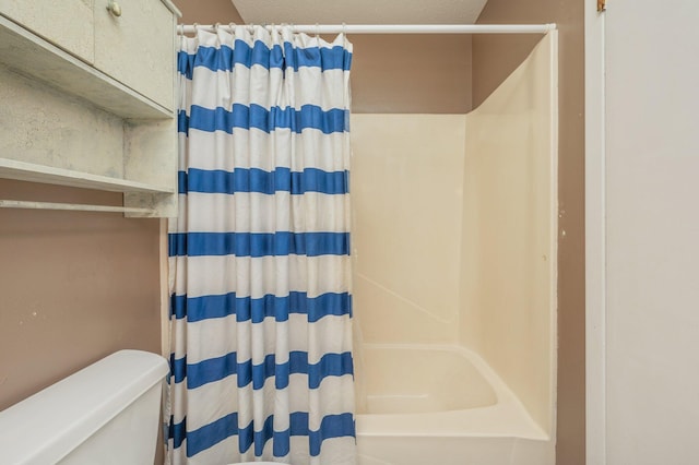 24776 Fifth Ave, Florala, AL 36442 - bathroom with shower / bath combo with shower curtain, toilet, and a textured ceiling
