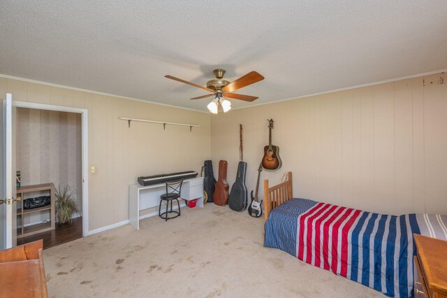 24776 Fifth Ave, Florala, AL 36442 - bedroom with carpet floors, a textured ceiling, ceiling fan, and ornamental molding