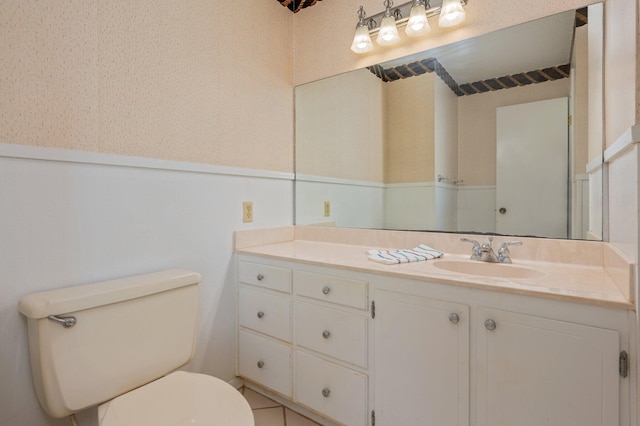 24776 Fifth Ave, Florala, AL 36442 - bathroom featuring vanity, toilet, and wainscoting