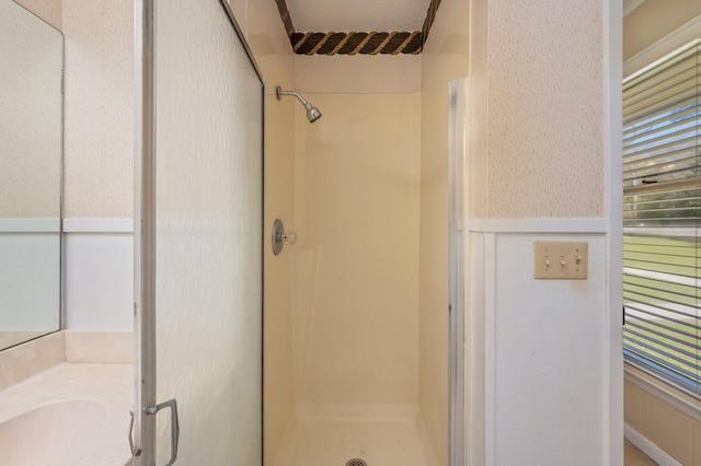 24776 Fifth Ave, Florala, AL 36442 - full bath with a wainscoted wall, a shower stall, and wallpapered walls