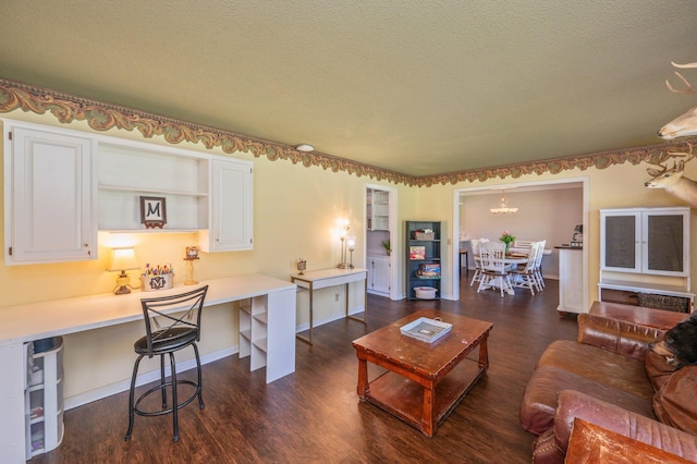 24776 Fifth Ave, Florala, AL 36442 - living room featuring dark wood finished floors, beverage cooler, a textured ceiling, and baseboards