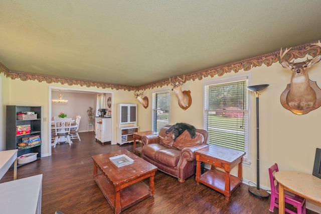 24776 Fifth Ave, Florala, AL 36442 - living room featuring wood finished floors, baseboards, and a textured ceiling