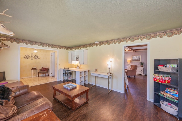 24776 Fifth Ave, Florala, AL 36442 - living area featuring wood finished floors, baseboards, and a textured ceiling