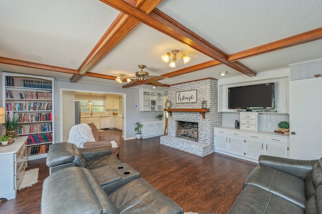 24776 Fifth Ave, Florala, AL 36442 - living room with ceiling fan, a textured ceiling, a brick fireplace, and dark wood finished floors