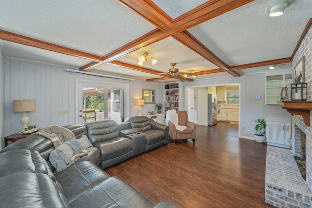 24776 Fifth Ave, Florala, AL 36442 - living room with dark wood-type flooring, beamed ceiling, a ceiling fan, and a textured ceiling