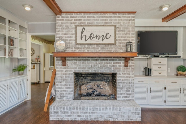 24776 Fifth Ave, Florala, AL 36442 - living room featuring a textured ceiling, dark wood-type flooring, a brick fireplace, and ornamental molding