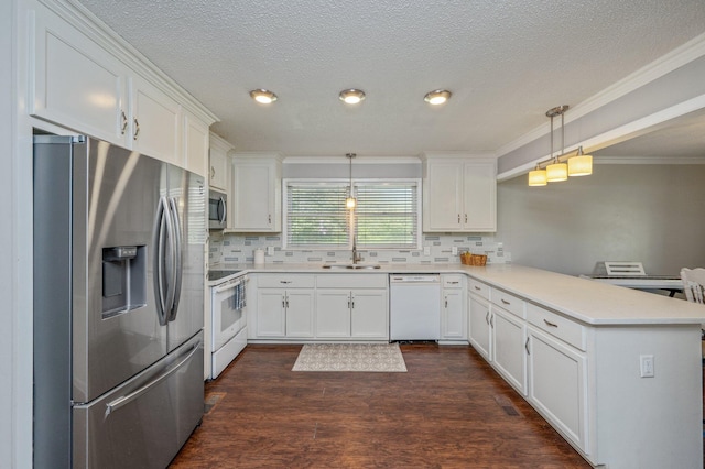 24776 Fifth Ave, Florala, AL 36442 - kitchen featuring dark wood finished floors, a peninsula, decorative backsplash, appliances with stainless steel finishes, and white cabinetry
