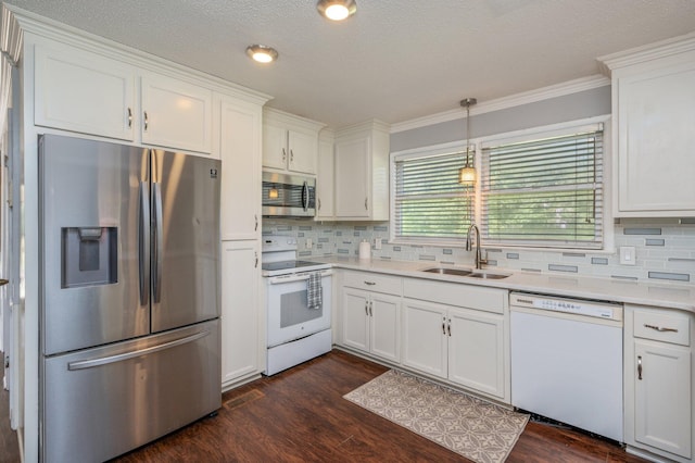 24776 Fifth Ave, Florala, AL 36442 - kitchen featuring a sink, appliances with stainless steel finishes, dark wood finished floors, and white cabinetry