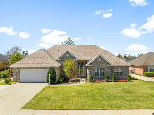 2511 Parkwood Dr, Panama City, FL 32405 - view of front of home featuring driveway, roof with shingles, an attached garage, a front lawn, and brick siding