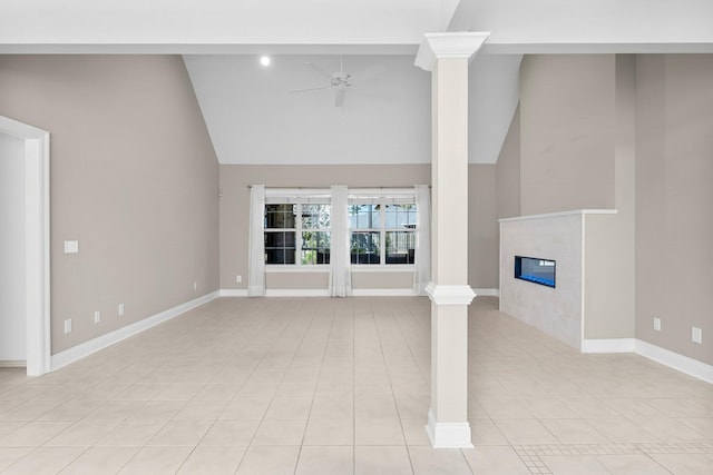 2511 Parkwood Dr, Panama City, FL 32405 - unfurnished living room featuring ornate columns, a tile fireplace, baseboards, and a ceiling fan
