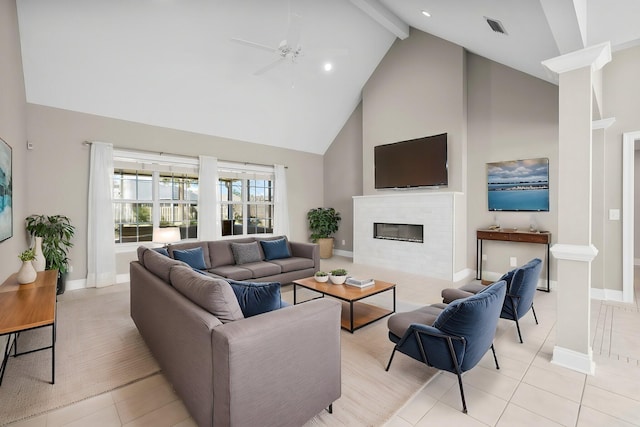 2511 Parkwood Dr, Panama City, FL 32405 - living area with a ceiling fan, visible vents, light tile patterned flooring, a glass covered fireplace, and beamed ceiling