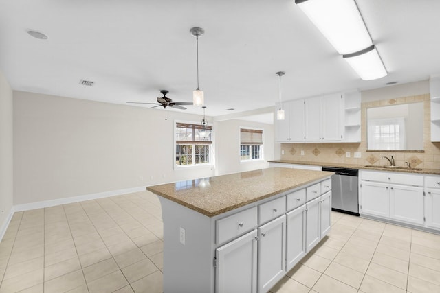 2511 Parkwood Dr, Panama City, FL 32405 - kitchen featuring visible vents, a center island, decorative backsplash, stainless steel dishwasher, and open shelves