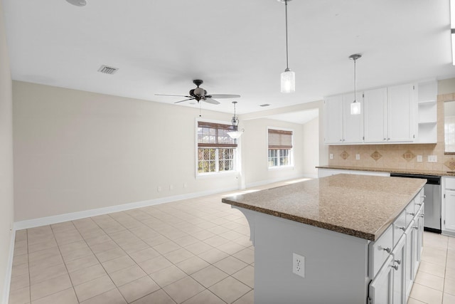 2511 Parkwood Dr, Panama City, FL 32405 - kitchen with white cabinetry, open shelves, ceiling fan, stainless steel dishwasher, and backsplash