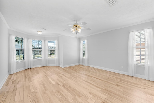 2511 Parkwood Dr, Panama City, FL 32405 - unfurnished room featuring visible vents, crown molding, baseboards, light wood-style flooring, and a ceiling fan