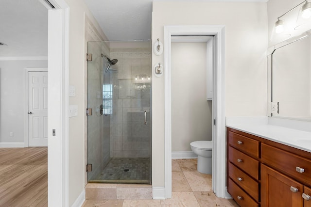 2511 Parkwood Dr, Panama City, FL 32405 - full bath with a shower stall, baseboards, toilet, ornamental molding, and vanity