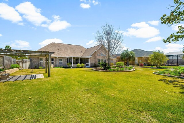 2511 Parkwood Dr, Panama City, FL 32405 - back of house with brick siding, a lawn, and fence