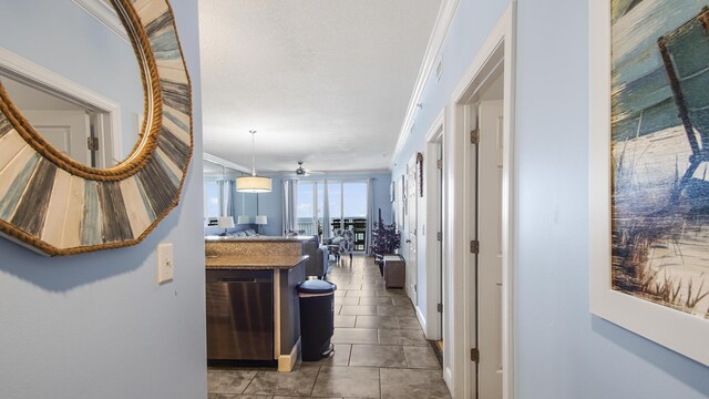 10519 Front Beach Rd Unit 1904B, Panama City Beach, FL 32407 - hallway featuring tile patterned floors and crown molding