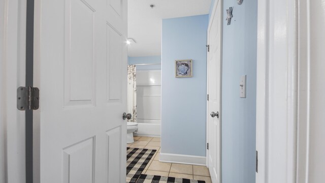 10519 Front Beach Rd Unit 1904B, Panama City Beach, FL 32407 - full bath featuring tile patterned flooring, toilet, shower / tub combo with curtain, and baseboards