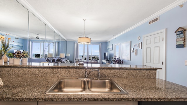 10519 Front Beach Rd Unit 1904B, Panama City Beach, FL 32407 - kitchen featuring visible vents, a sink, open floor plan, crown molding, and ceiling fan